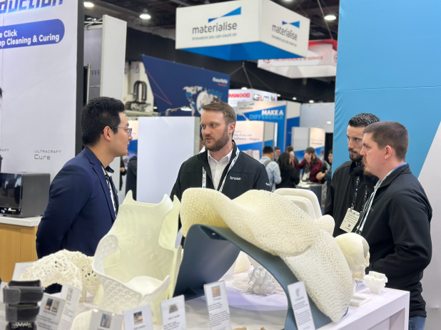 TPM3D engineers explaining SLS 3D printing solutions to visitors at RAPID+TCT 2025