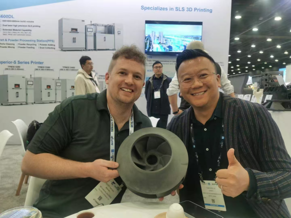 TPM3D overseas sales director Louis Lu and client at RAPID+TCT 2025