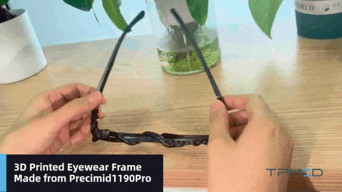Hands holding 3D printed glasses