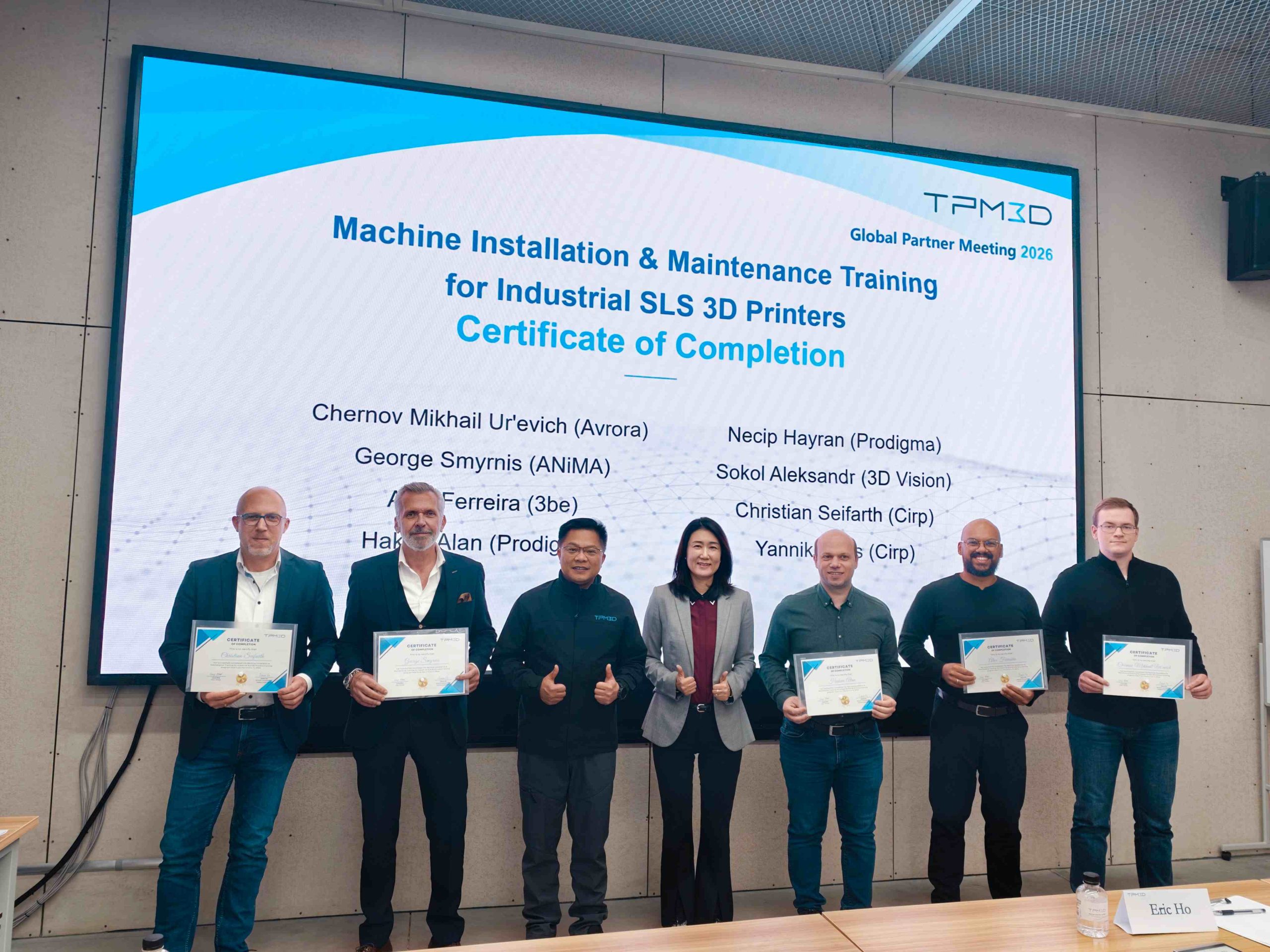 TPM3D CEO and CTO awarding certification to trained partners for industrial SLS 3D printing systems